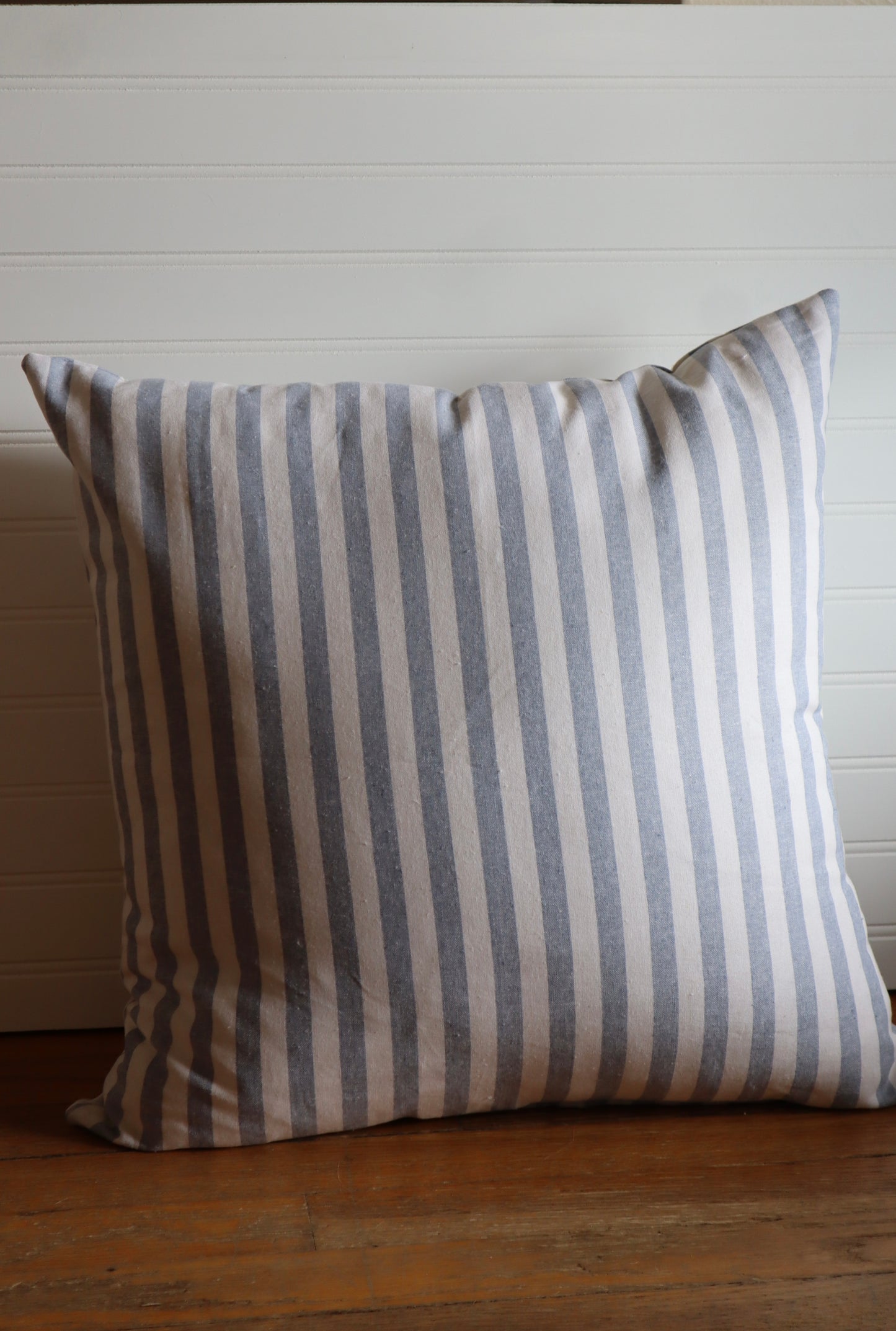blue pin striped throw pillow