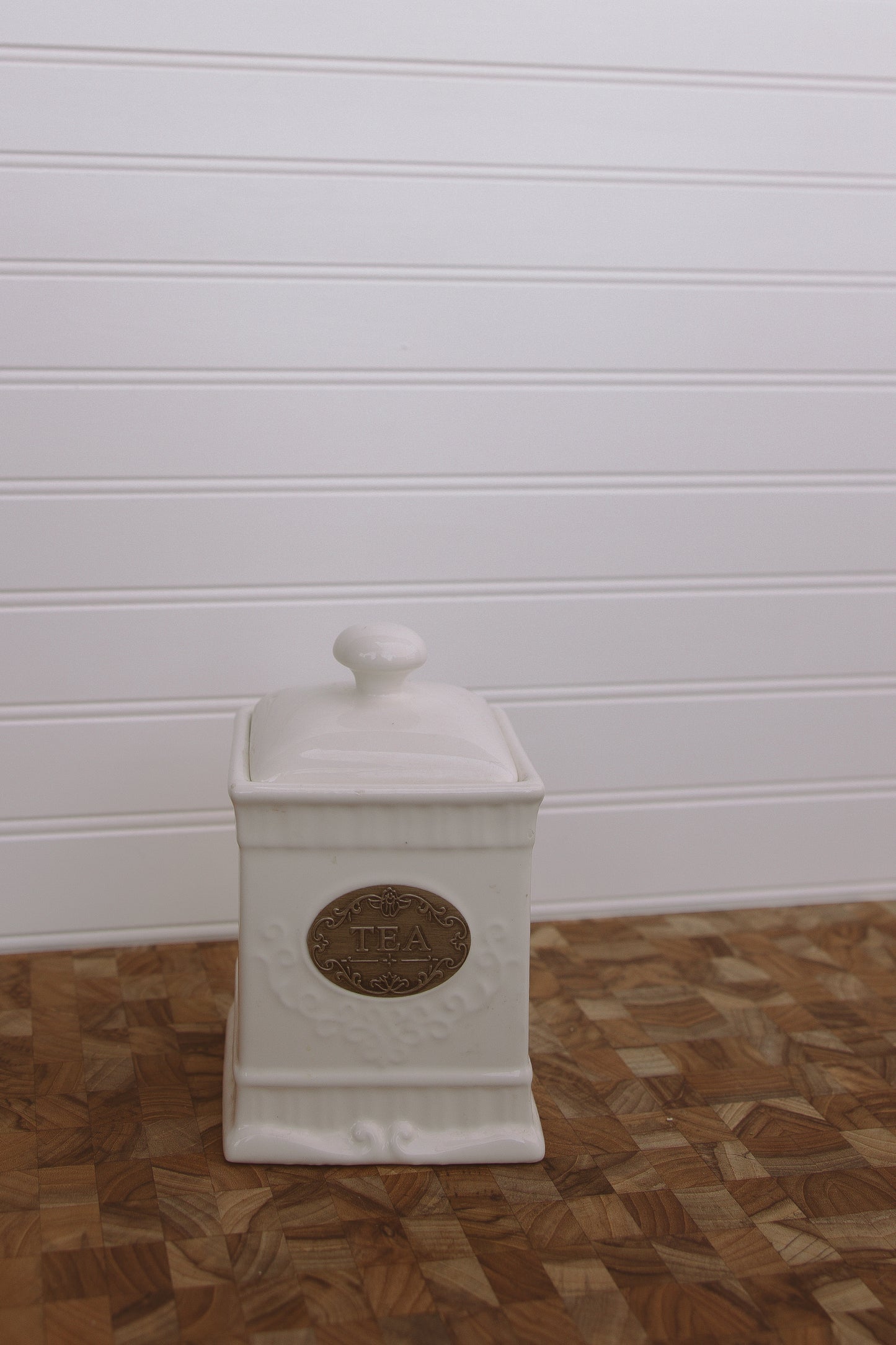 white ceramic tea jar