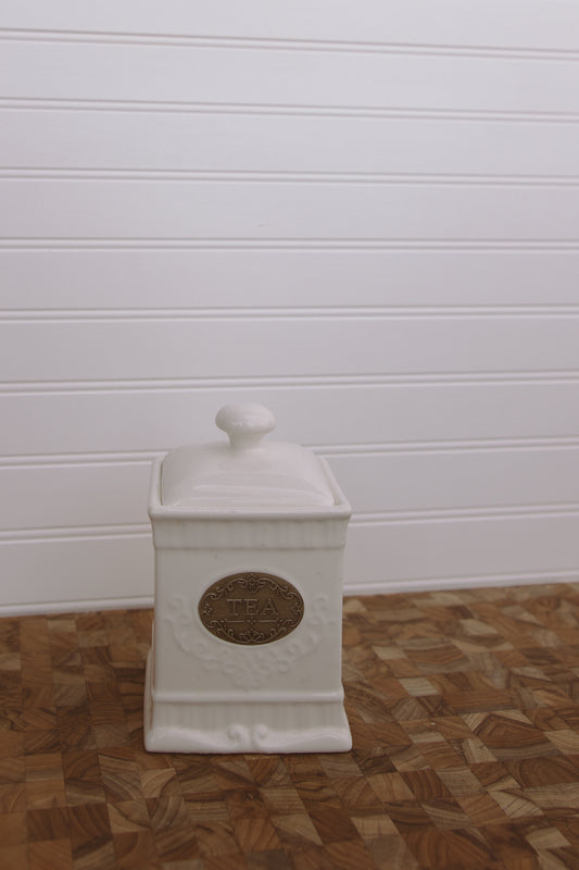 white ceramic tea jar