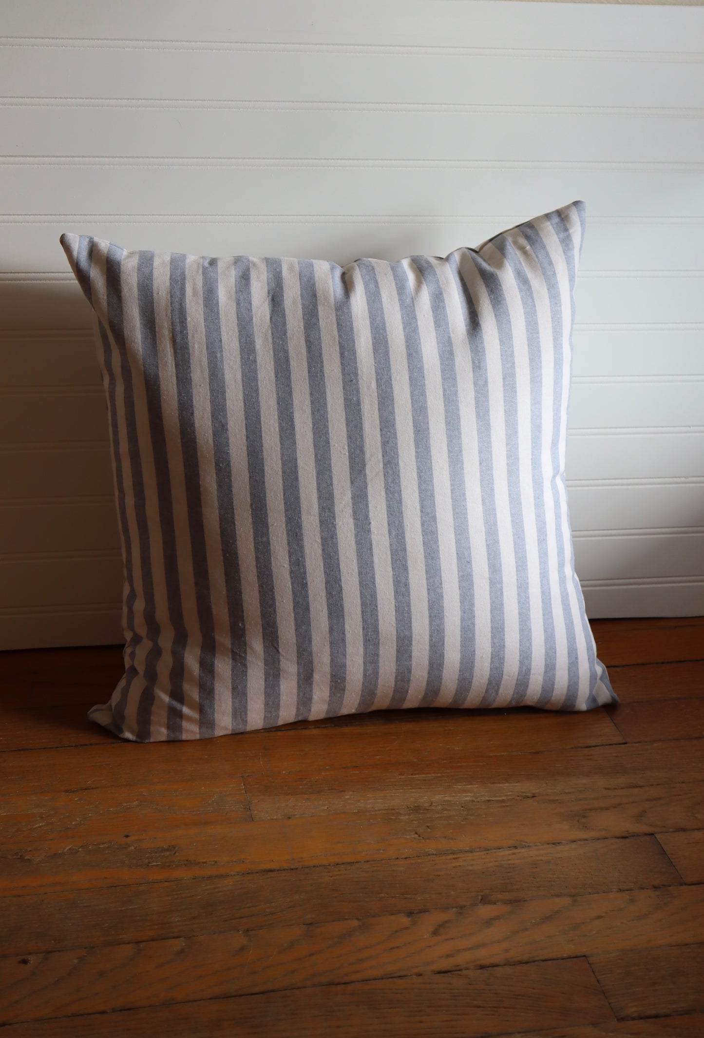 blue pin striped throw pillow