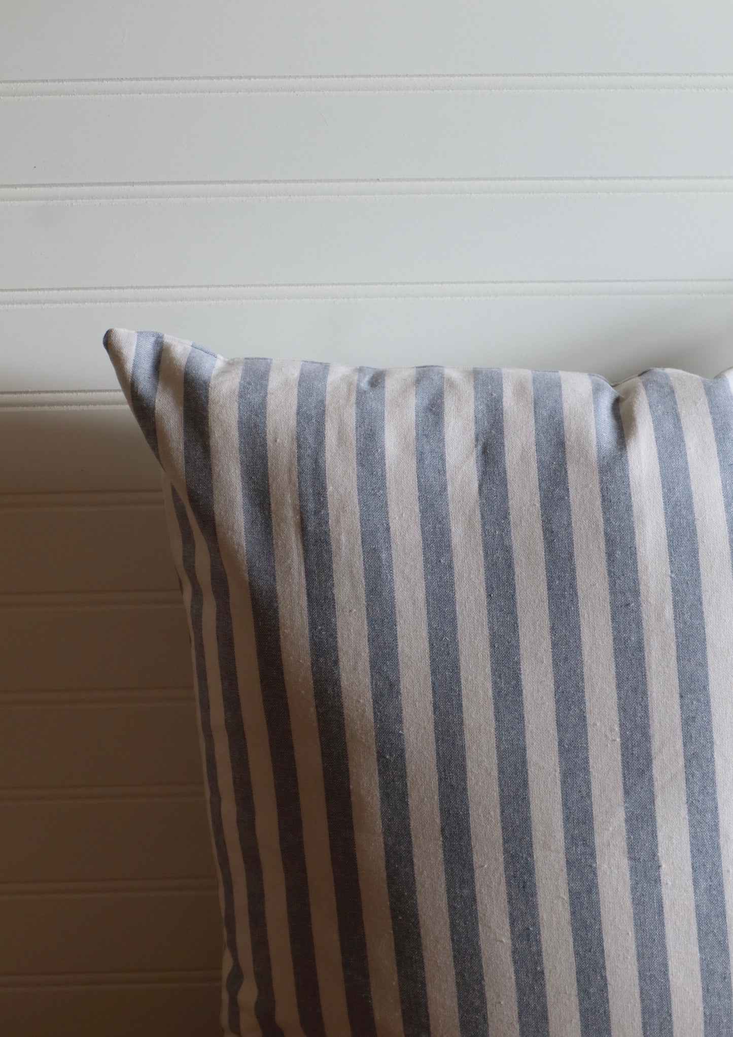 blue pin striped throw pillow